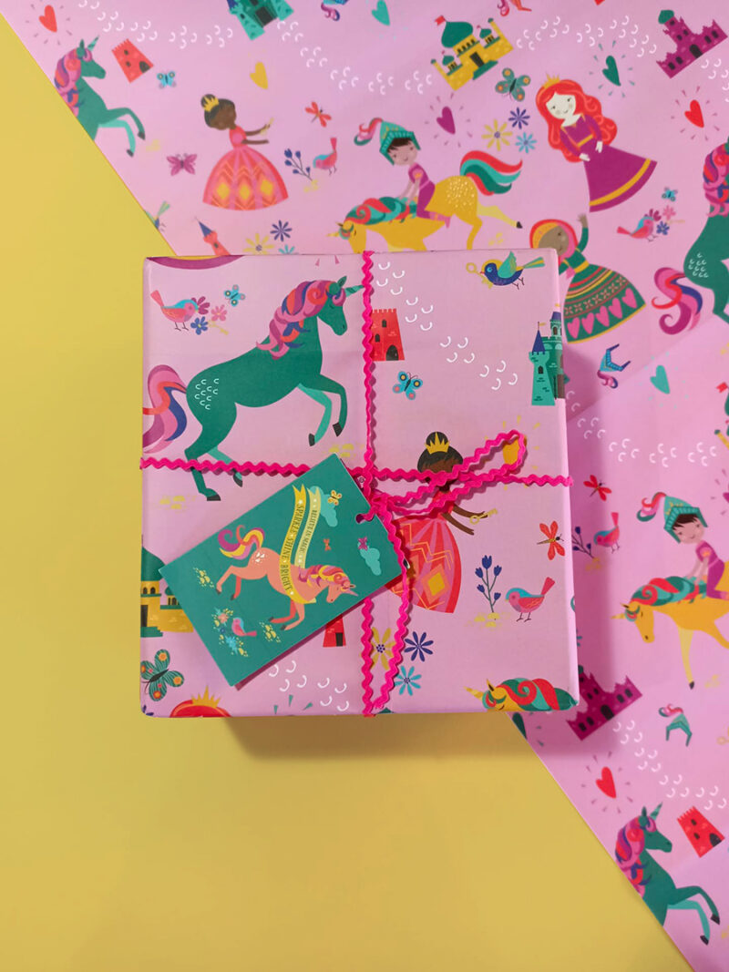 present wrapped in princess unicorn gift wrap, unicorn tag and pink ribbon.