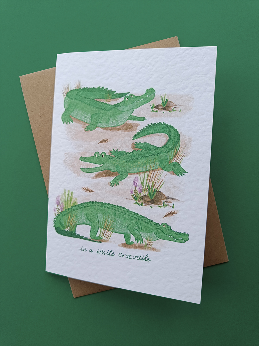 Illustrations of 3 saltwater crocodiles on a white card with Kraft envelope