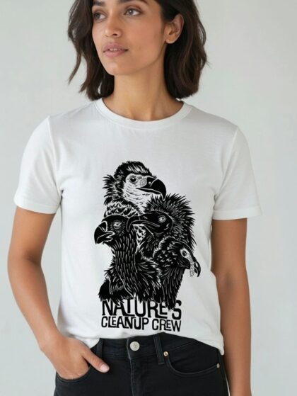 Woman wearing white t-shirt with Curious Kin's natures clean up crew vultures design printed on it