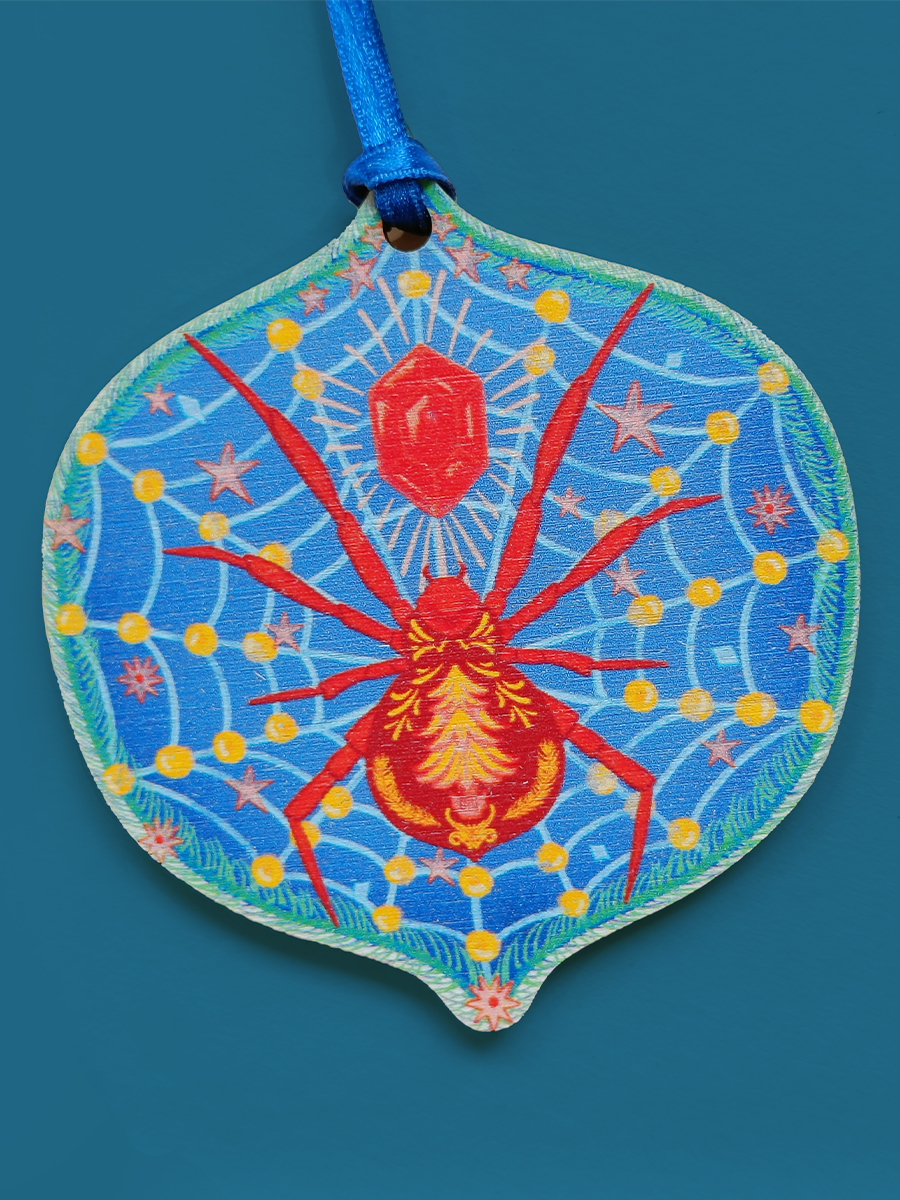 Wooden decoration of a christmas spider on a jewelled web