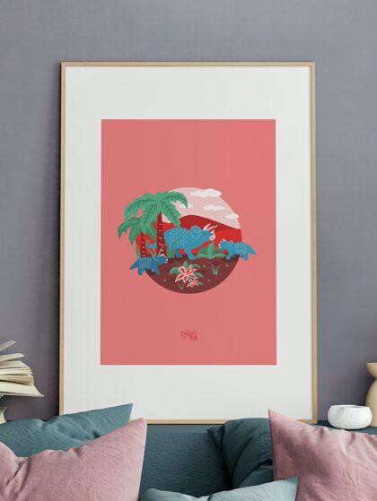 Framed triceratops family art with sofa, cushions and book open.