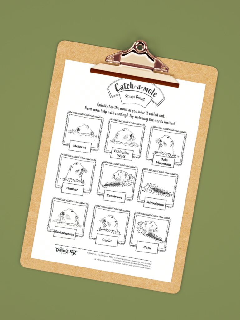 Clipboard with Curious Kin catch a mole word activity page attached