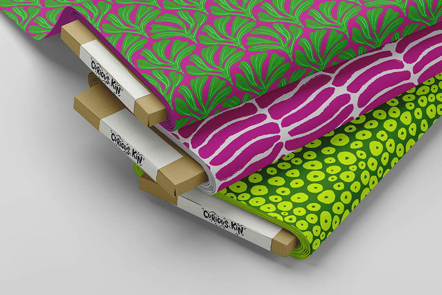 Fabric samples of Curious Kin's neon fossils pattern collection including abstract stripe, polka dot and ginkgo leaf patterns in magentas and greens.