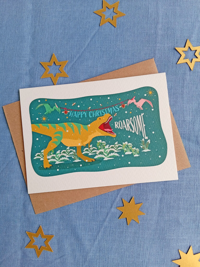 t-rex christmas card with kraft envelope happy Christmas 'roarsome'