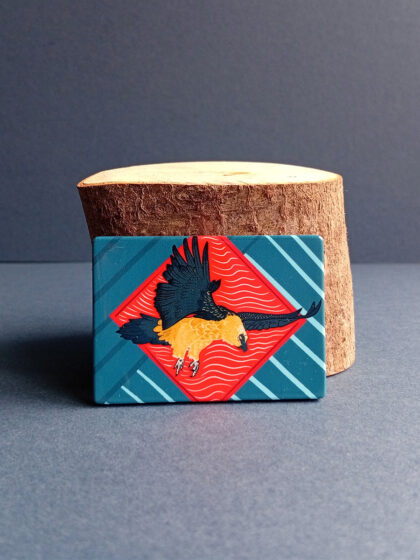 Rectangular illustrated bearded vulture magnet made from recycled plastic.