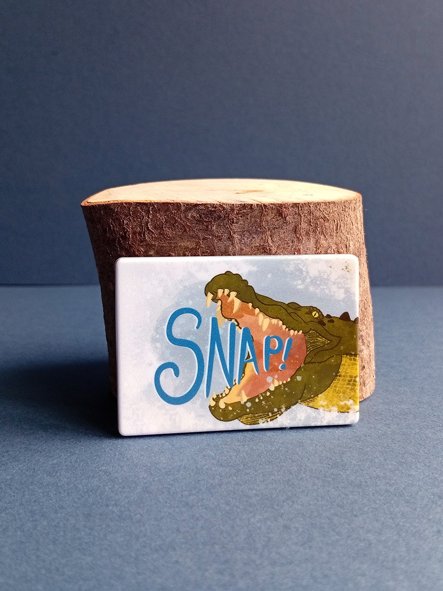 Rectangular illustrated saltwater crocodile magnet made from recycled plastic.