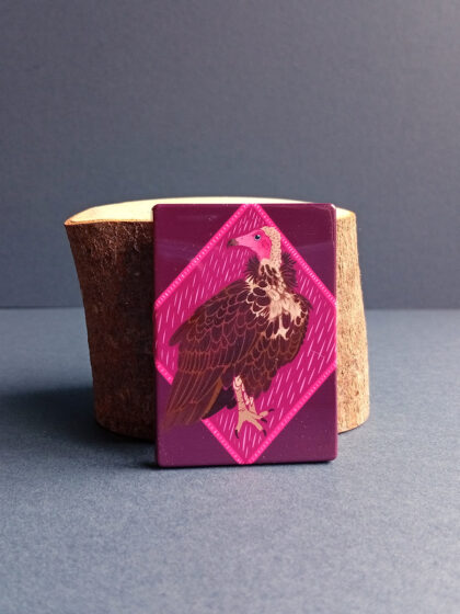 Rectangular illustrated hooded vulture magnet made from recycled plastic.