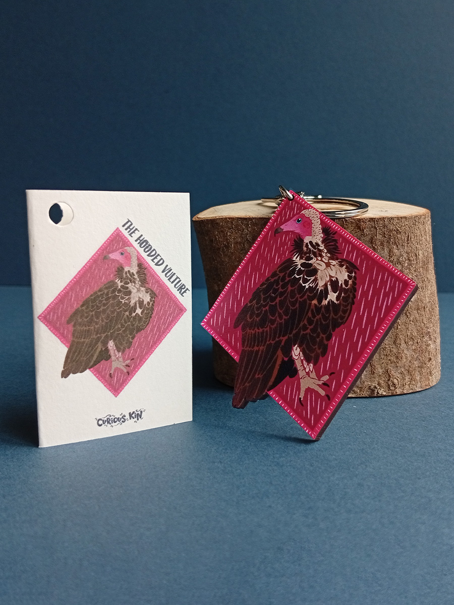 Diamond shaped keyring made from sustainably sourced wood, UV printed with rich hooded vulture design. Next to complimenting fun fact mini card.
