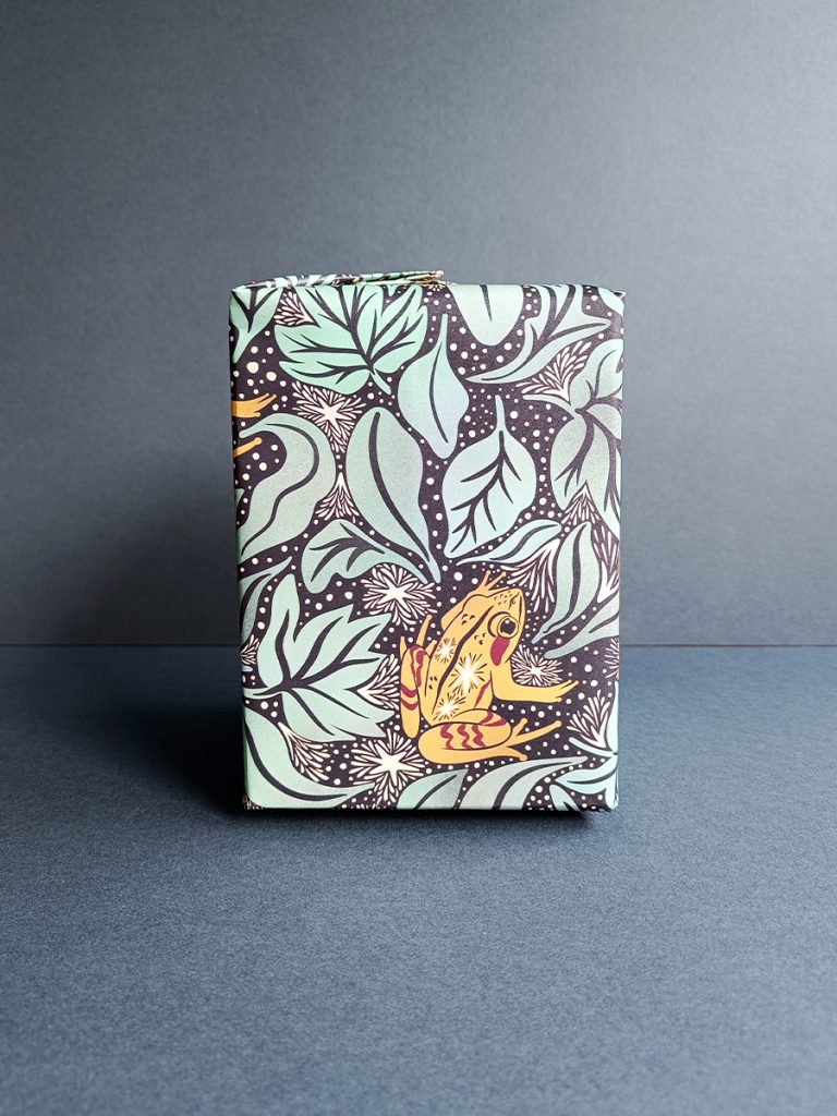 Gift wrapped in alaskan wood frog and frosted leaf litter luxury gift wrap