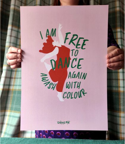 A3 illustrated dancing woman surrounded with words I am free to dance again awash with colour in pink, red and green soft colours.