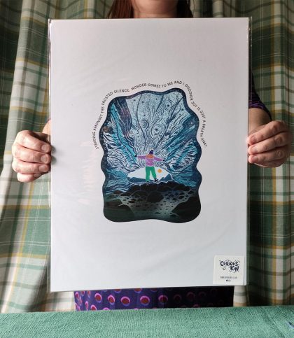 A3 print of a Woman explorer standing in an ice cave balancing on one leg with original quote.