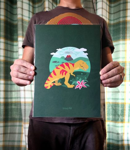 Bold and Bright illustration of a yellow t-rex with red stripes standing in front of an erupting volcano on an evergreen background.