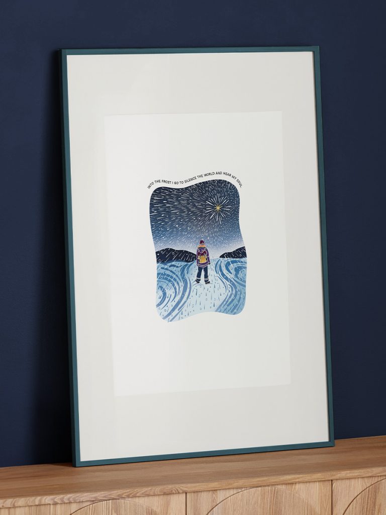 A3 framed art of a woman explorer standing in a snowstorm looking up a bright large star with original quote.