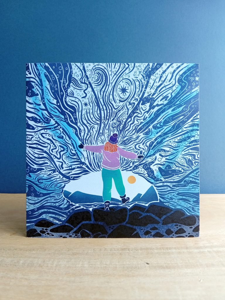 Square card with ice wonder illustration of a Female explorer standing in an ice cave open armed.