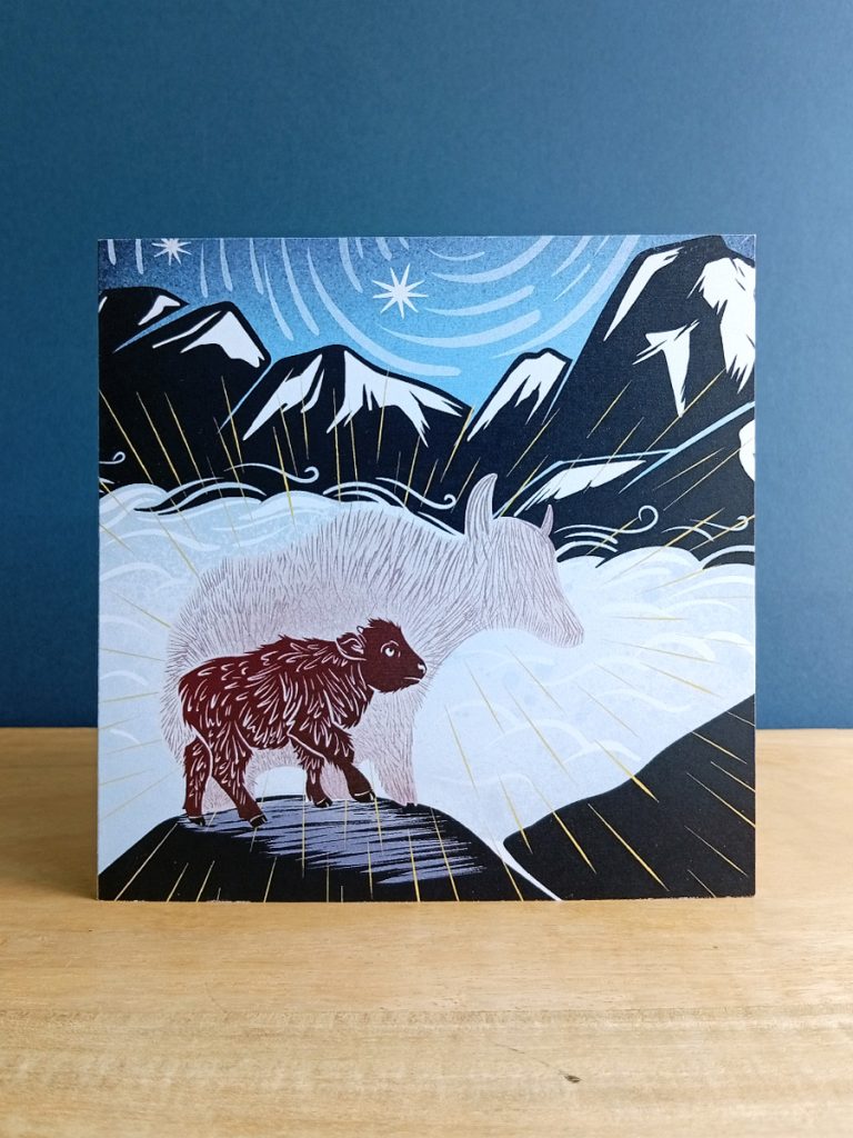 Little Yak looking up at their bigness in a scape of cloud and mountain