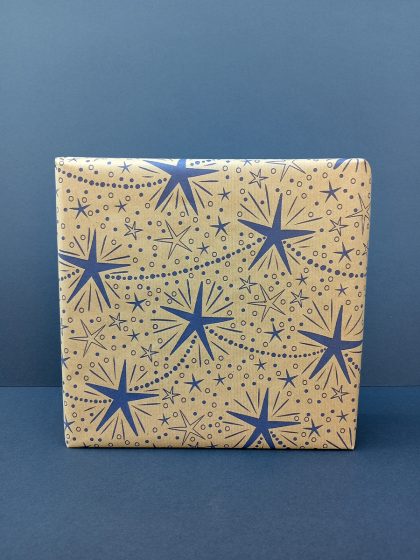 Gift wrapped in hand drawn twinkly star chain recycled wrapping paper.