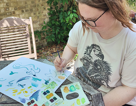 Min in the garden painting wearing here bestselling natures cleanup crew vulture tee.